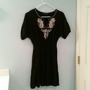 Black dress with white embroidery